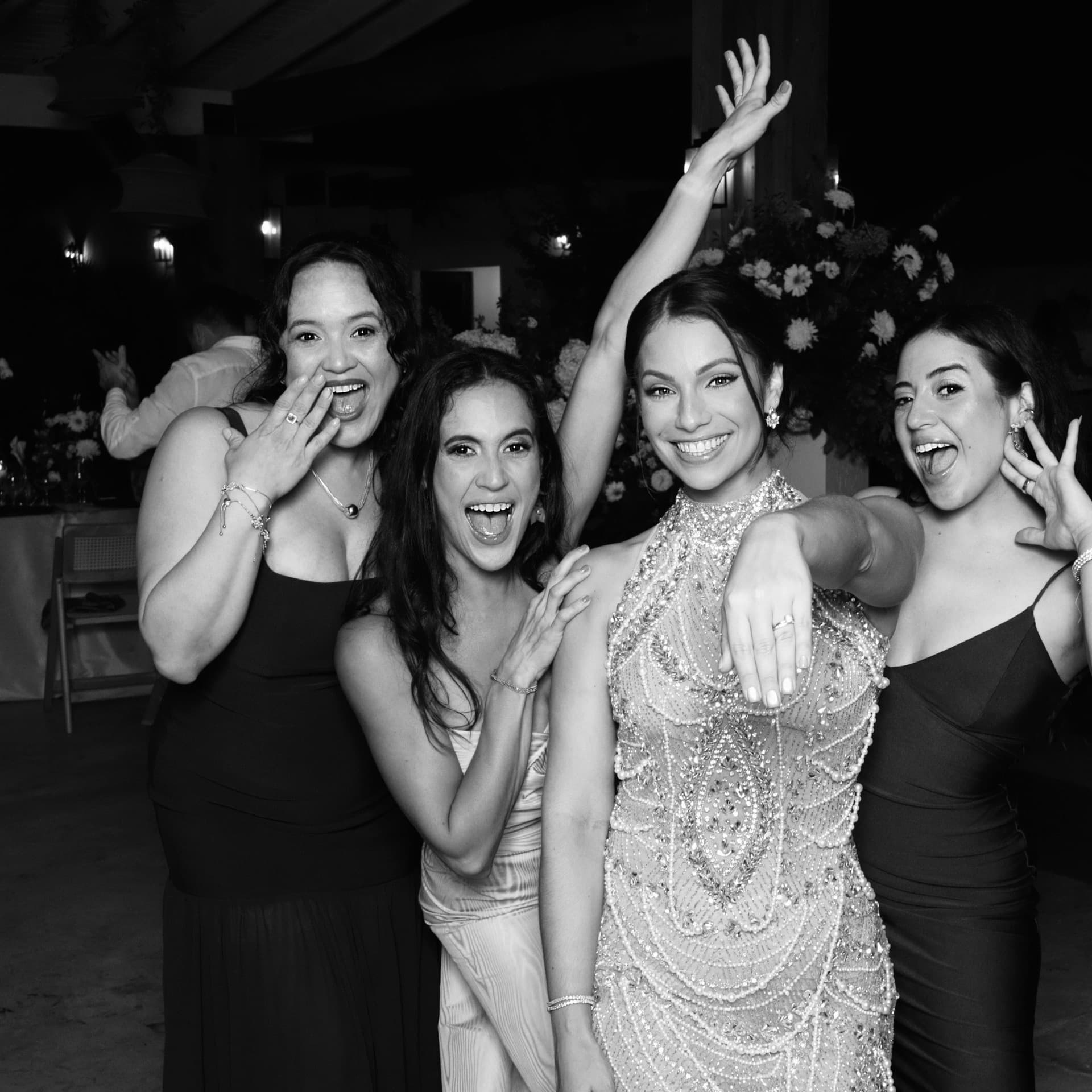 Bride and guests celebrating at the Luxpiq photo booth at a wedding reception